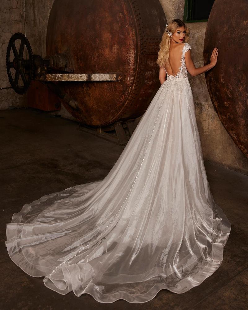 122242 sparkly wedding dress with overskirt and plunging neckline6
